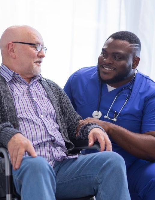 Healthcare professional with elderly patient